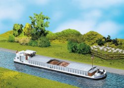 River cargo boat with dwelling cabin